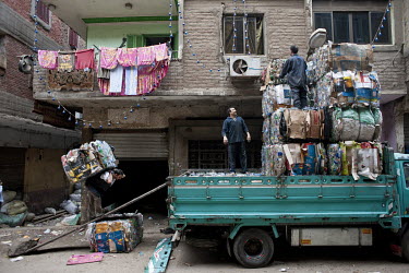 A truck loaded with compacted rubbish in Muqattam, a poor Christian suburb whose inhabitants are known as the Zabaleen, a minority community of Coptic Christians who have for many years served as the...