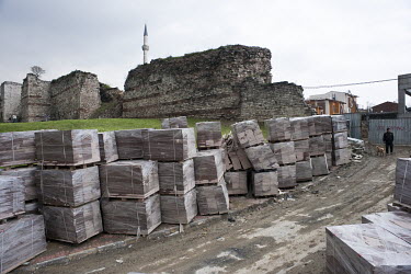 Building materials stacked near the Byzantine city wall in Sulukule in the Fatih district. Sulukule, a historic Roma district, has been razed after it was declared an 'Urban Transformation Zone' by th...