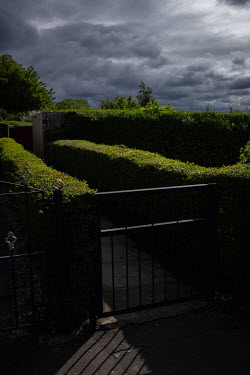 A gate and border hedges in Restalrig.  Hedges offer increased privacy, isolating the homeowner and emphasising the division of public and private space. Where boundaries between properties meet we se...