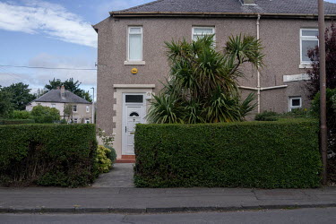 A palm tree in a garden in Granton.  Hedges offer increased privacy, isolating the homeowner and emphasising the division of public and private space. Where boundaries between properties meet we see a...