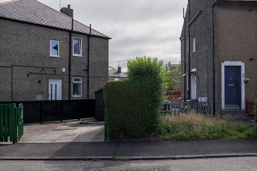 A boundary hedge cut by one homewonever but not their neighbour in Granton.  Hedges offer increased privacy, isolating the homeowner and emphasising the division of public and private space. Where bou...