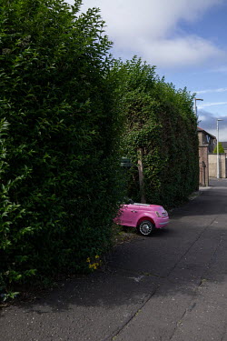 A child's toy car seen on the pavement in Granton. Hedges offer increased privacy, isolating the homeowner and emphasising the division of public and private space. Where boundaries between properties...