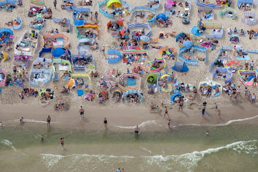 Large crowds on a public beach in Wladyslawowo, a small tourist town on the Baltic Sea, on the sunny first weekend of August. This is usually one of the most crowded beaches in Poland and 2020 has bee...
