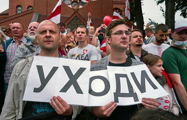 Activists holds a sign that reads: 'Leave' (ukhadi) during an anti-government, pro-democracy demonstration on Independence Square. More than 100,000 protesters were involved in the rally in central Mi...