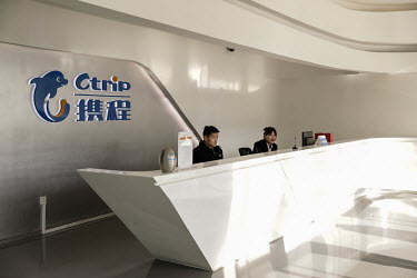 Staff on the reception desk of travel company Ctrip.com (part of the Trip.com Group Ltd.) at their headquarters in the Sky Soho building.