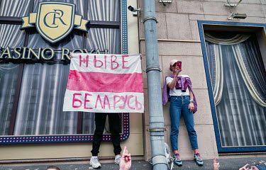 A protestor holds a homemade red and white flag (adopted by the Belarusian opposition) with the slogan 'Long Live Belarus' (Zhive Belarus) during an anti-government, pro-democracy demonstration in Ind...