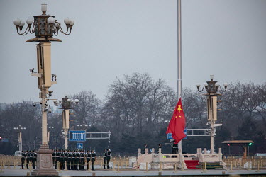 Members of the People's Liberation Army honour guard participate in a flag raising ceremony on Tiananmen Square.