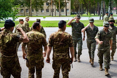 NATO ground troops greet each other at the Adazi barracks from where a joint exercise involving forces from various member countris is being operated.