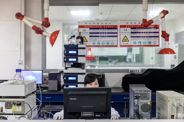 A technician conducts a test in a quality control laboratory at a China Grand Pharmaceutical and Healthcare Holdings Ltd. facility.