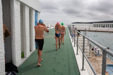 People swimming in the Jubilee lido on the first day it was open after weeks closed during the first coronavirus lockdown. On the first day the facilty was open to NHS staff and other keyworkers.