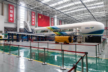 A flight simulator for the Commercial Aircraft Corp. of China Ltd. (Comac) C919 aircraft stands in the Comac Shanghai Research and Development Center .