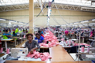 Women working at sewing stations in one of the few textile factories owned by a Swazi businesswoman.