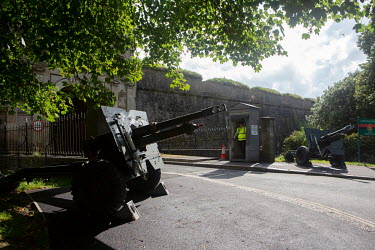 A pair of howitzer guns stand at the entrance to the Citadel which is still used as a barracks for the Royal Artillery.