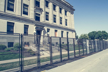 A metal security fence surounds the court building which was damaged during protests, some violent, against the police shooting of Jacob Blake.