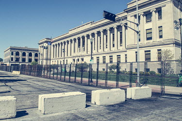 A metal security fence, and concrete road blocks, surounds the court building which was damaged during protests, some violent, against the police shooting of Jacob Blake.