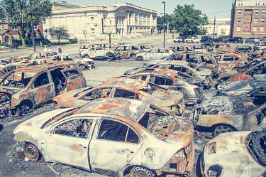 Burned out cars on the forecourt of a vehicle dealership on the day after protests, some violent, erupted following the police shooting of Jacob Blake.