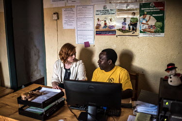 People working in the Volunteers Developmnent Association of Uganda, (VODA) office.