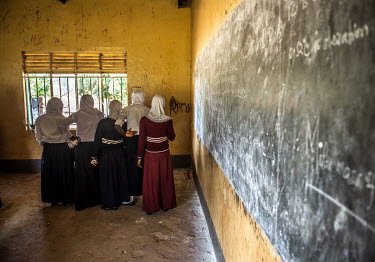 Secondary school students wait for their results after being tested for sexually transmitted infections.