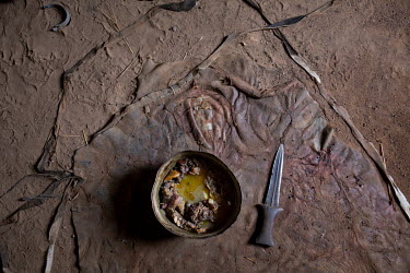 A bowl of cooked meat in the home of two elderly brothers who have scavenged the meat from butcher in the market. Ajany (60) lives in one room with his brother Wol (70) and their children. Ajany's wif...