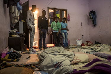 A group of migrants from Sub-Saharan Africa in their rented house, where up to 10 people live in very poor conditions. housi