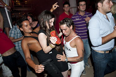People dancing at Es Paradis discotheque in San Antonio.