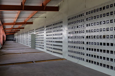 Technicians walk through a cooling chamber adjacent to a wall of bitcoin mining computers at a warehouse mining facility operated by Bitmain Technologies Ltd. Bitmain is one of the leading producers o...