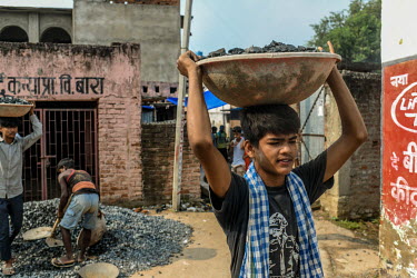 Mumtaz (12) working at a construction site along with his father in Bara village. He is working as schools have been closed due to the coronavirus lockdown.