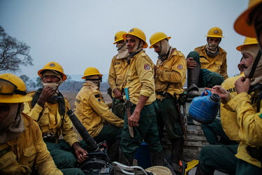 Members of the Brazilian Institute for the Environment and Renewable Natural Resources (IBAMA) fire brigade travel to the Santa Tereza farm, in the Pantanal, where they are needed to try and control a...