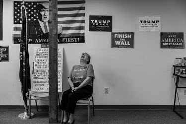 Judy Phelps (71), a social worker, in the GOP (Republican party) committee surrounded by pro-Trump election slogans. She says she voted twice for Barack Obama (2008 and 2012) but in 2016 changed her v...