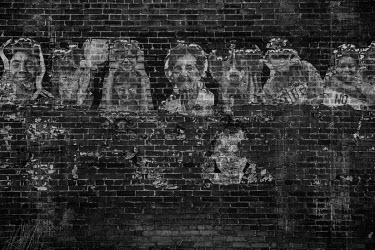 Pictures of former residents fixed on a wall in an abandoned building in downtown Braddock, a town hit hard by urban decline.   The population of Pittsburgh, the urban area that Braddock is a part of,...