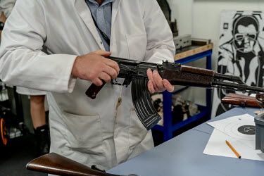 An AK 47 rifle is checked during a training exercise at the National Ballistics Intelligence Service.
