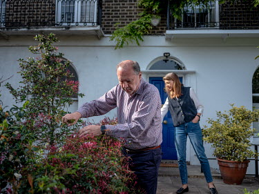 The Director of the London School of Hygiene and Tropical Medicine, Professor Baron Peter Piot with his wife Heidi photographed in the front garden of their house in London.