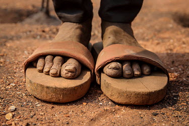 Day labourer's feet tell their tales. Thousands of men, women and children toil in the open their muddy clothes, coal dust engrained skins and bare feet reveal how everyday they struggle to live a lif...