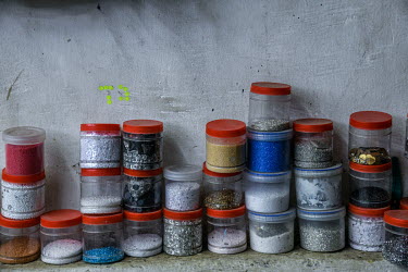 Beads and sequins stored at an embroidery subcontractors, a small factory housed in a residential block. The factory does not adhere to the Indian government's Factory Act or employment laws.