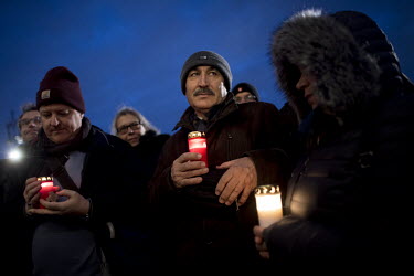 People holding candles gather near the Brandenburger Gate in a show of solidarity following a shooting the previous day in Hanau. The suspect Tobias R. shot dead ten people in two shisha bars. Police...