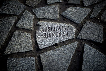 On the 75th anniversary of the liberation of the Auschwitz death camp, 'Auschwitz Birkenau' is seen carved into one of the granite slabs that form the memorial, near the Reichstag, to the Sinti and Ro...