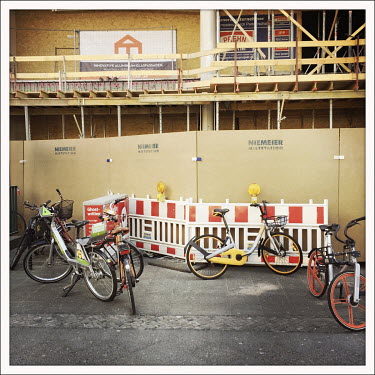Rental bycycles outside a boarded up closed shop at the Kurfuerstendamm U-Bahn.  The Berliner Ku'damm is lined with luxury boutiques, hotels and restaurants. The coronavirus has resulted in deserted p...