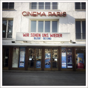 The closed Cinema Paris with the slogan 'Wir Sehen Uns Wieder Bleibt Gesund' on the Kurfuerstendamm.  The Berliner Ku'damm is lined with luxury boutiques, hotels and restaurants. The coronavirus has r...