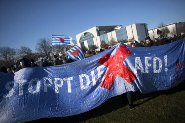 A banner reads 'Stop the AFD!' during a protest, outside the Chancellery Office, following the election of Thomas Kemmerich (FDP) as premier of Thuringia which was achieved with the support of the rig...