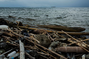 A small island that is being built up with coral, wood and rubbish, in the San Blas Archipelago, possibly for the construction of a house. Islands in the archipelago are suffering from destructive tid...