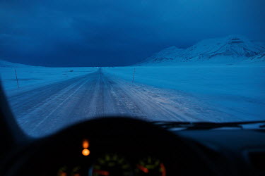 A car travels along a frozen road on the outskirts of Longyearbyen, the northernmost city on the planet, near the Global Seed Vault. Temperatures in this region are warming faster than anywhere else o...