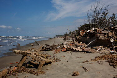 Partially-submerged debris from structures destroyed by marine erosion in Ilha Comprida, along the southern coast of Sao Paulo state.