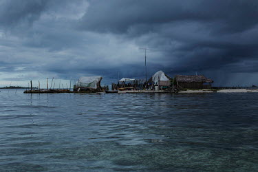 A storm approaches Banedub Island, in the San Blas archipelago where many islands are suffering from destructive tidal surges and human overpopulation, forcing the indigenous Guna people to abandon th...