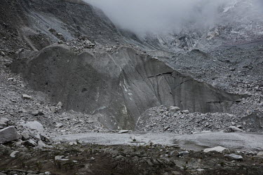 The mouth of the rapidly retreating Llaca glacier in the Cordillera Blanca mountain range. Melting glaciers have created high water levels in mountain lakes and avalanches flowing into such lakes have...