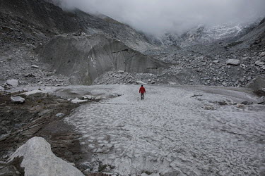 Farmer and mountain guide Saul Luciano Lliuya walks over the rapidly retreating Llaca glacier which feeds the nearby Llaca Laggon in the Cordillera Blanca mountain range. Saul is suing a German energy...