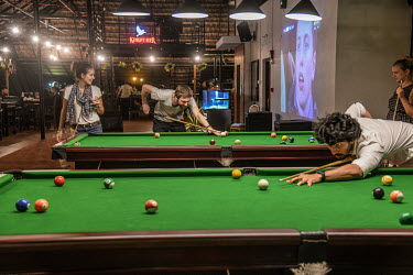 Tourists play pool in Hotel No 18 in Fort Kochi.