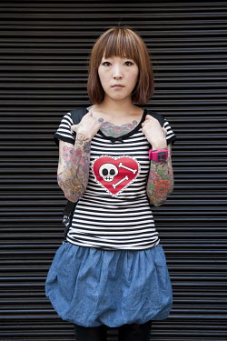 A tattooist at the Amerikamura or American Village, a sizable retail and entertainment area near Shinsaibashi in the Minami district of Osaka.