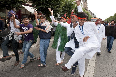 Members of the Indian Hindu community celebrating Ganesh Chaturthi with a procession through the city.