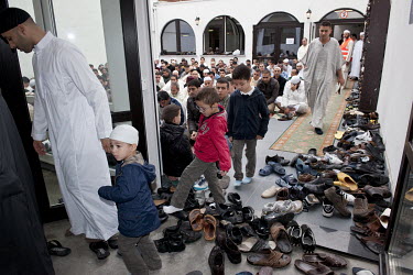 People remove their shoes during morning prayers at a Moroccan mosque on the day the Sugar Feast (Eid ul-Fitr) begins at the end of Ramadan.