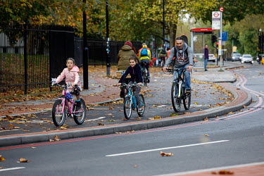People riding bicycles along cycle path in Rotherhithe, Southwark